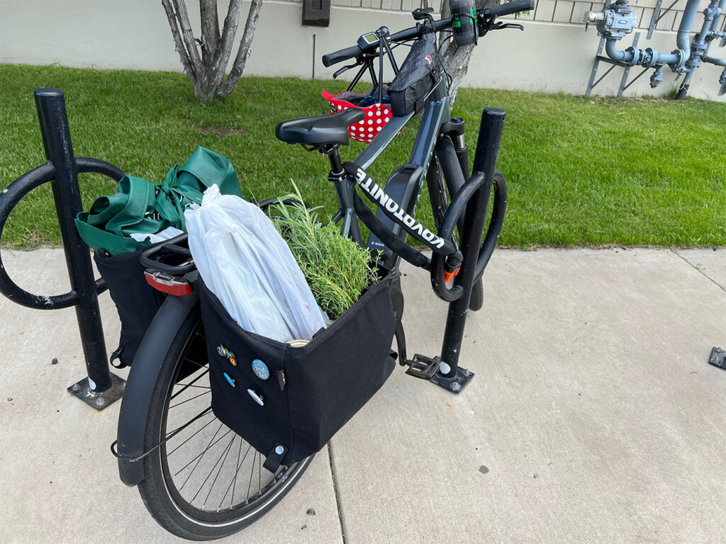 erin's ebike locked up to a bike rack