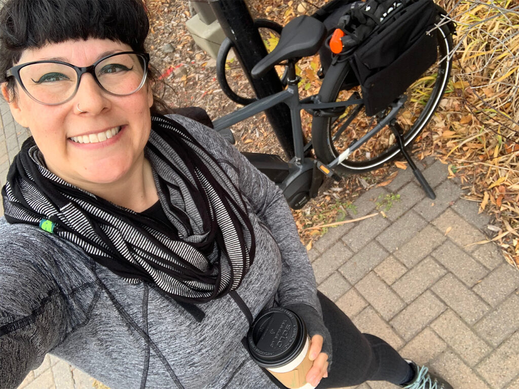 Erin posing in front of her ebike 